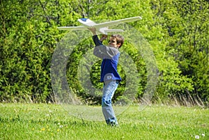 Boy Throwing Toy Plane