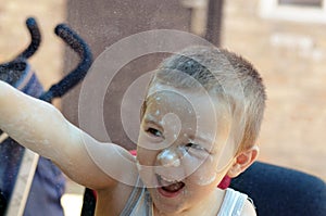 Boy throws the flour until