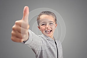 Boy with thumbs up agreeing