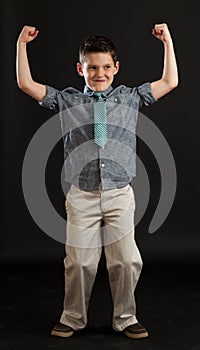 Boy in Tie Flexing Muscles