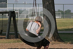 Boy on Tire Swing photo