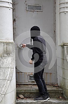 Boy tires to open a door