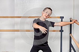 Boy to study ballet at the ballet school. The hand on the ballet Barre.