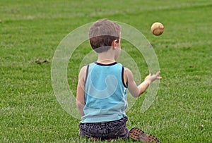 Boy Tossing Baseball