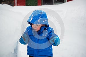 Boy Touching a Deep Snowbank