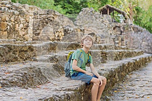 Boy tourist at Coba, Mexico. Ancient mayan city in Mexico. Coba is an archaeological area and a famous landmark of