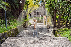 Boy tourist in Herceg Novi old town. Historical and touristic center of Herceg Novi. Montenegro