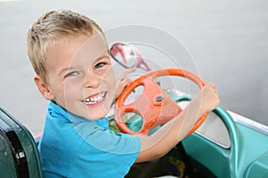 Boy in toy car