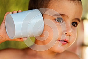 Boy with a toy communication device