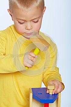 Boy with toy hammer