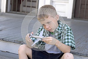 Boy and toy plane