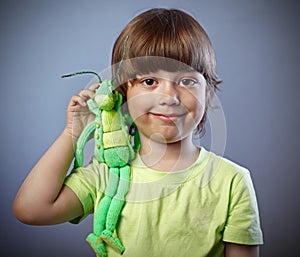 Boy with toy on shoulder