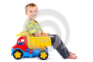 Boy with toy truck