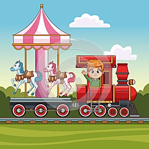 Boy in train with carrousel