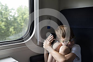 Boy on the train. Travel by railway. Rules for traveling on train with children