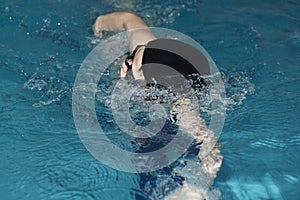 The boy trains in pool