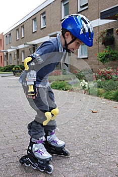 Boy trains with rollerblades