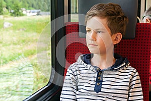 Boy travels by train