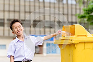 Boy trow the garbage