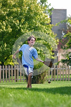 Boy Trying to Catch Ball