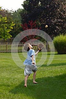 Boy Trying to Catch Ball