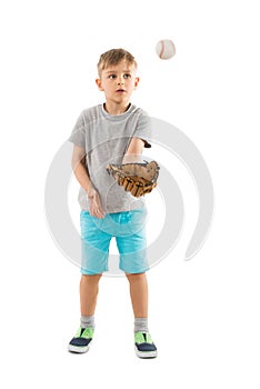 Boy Trying To Catch Baseball In His Glove