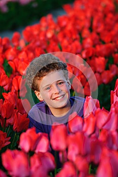 Boy in tulips field