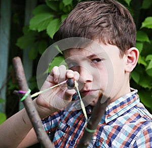 Boy with turnpike aiming to the target