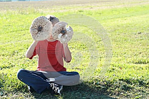 Boy with two parasol mushrooms