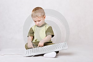 Boy typing on keyboard