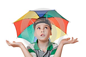 Boy with umbrella on head spread hands aside photo