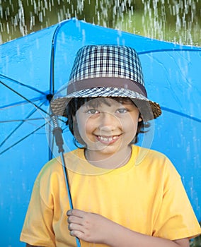 Boy with umbrella outdoors