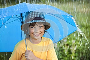 Boy with umbrella outdoors