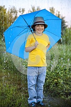 Boy with umbrella outdoors