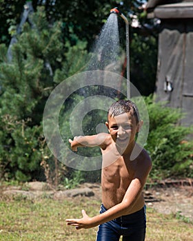 Boy under a shower