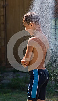 Boy under a shower
