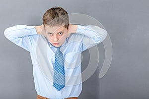 Boy under stress closes his ears