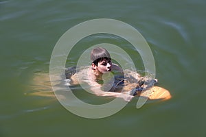 Boy with underwater scooter