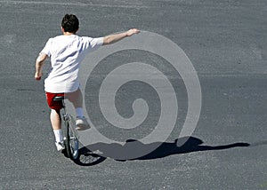 Boy on a unicycle photo