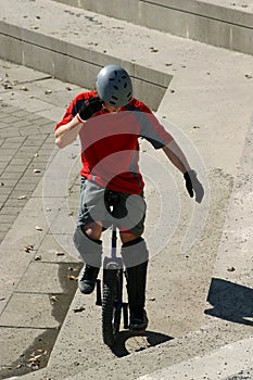 Boy on unicycle