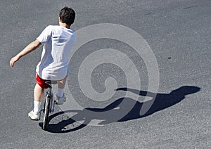Boy on a unicycle photo