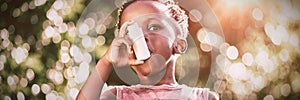 Boy using a asthma inhalator photo