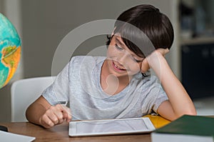 Boy using digital tablet