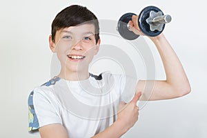 Boy using dumbbell weights