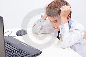 Boy using his laptop computer