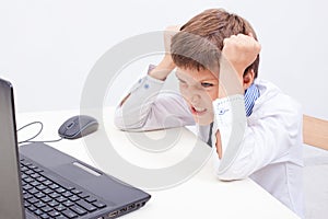 Boy using his laptop computer