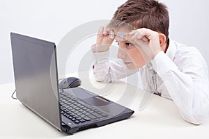 Boy using his laptop computer