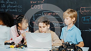 Boy using laptop programing engineering code and writing program. Erudition.