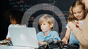 Boy using laptop programing engineering code and writing program. Erudition. photo