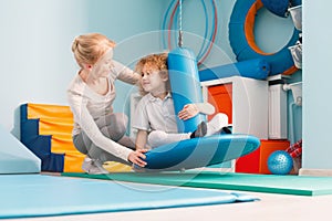 Boy using sensory integration equipment